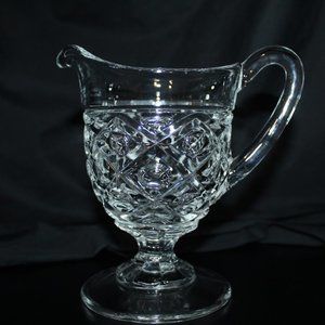 Diamond thumb print footed glass pitcher